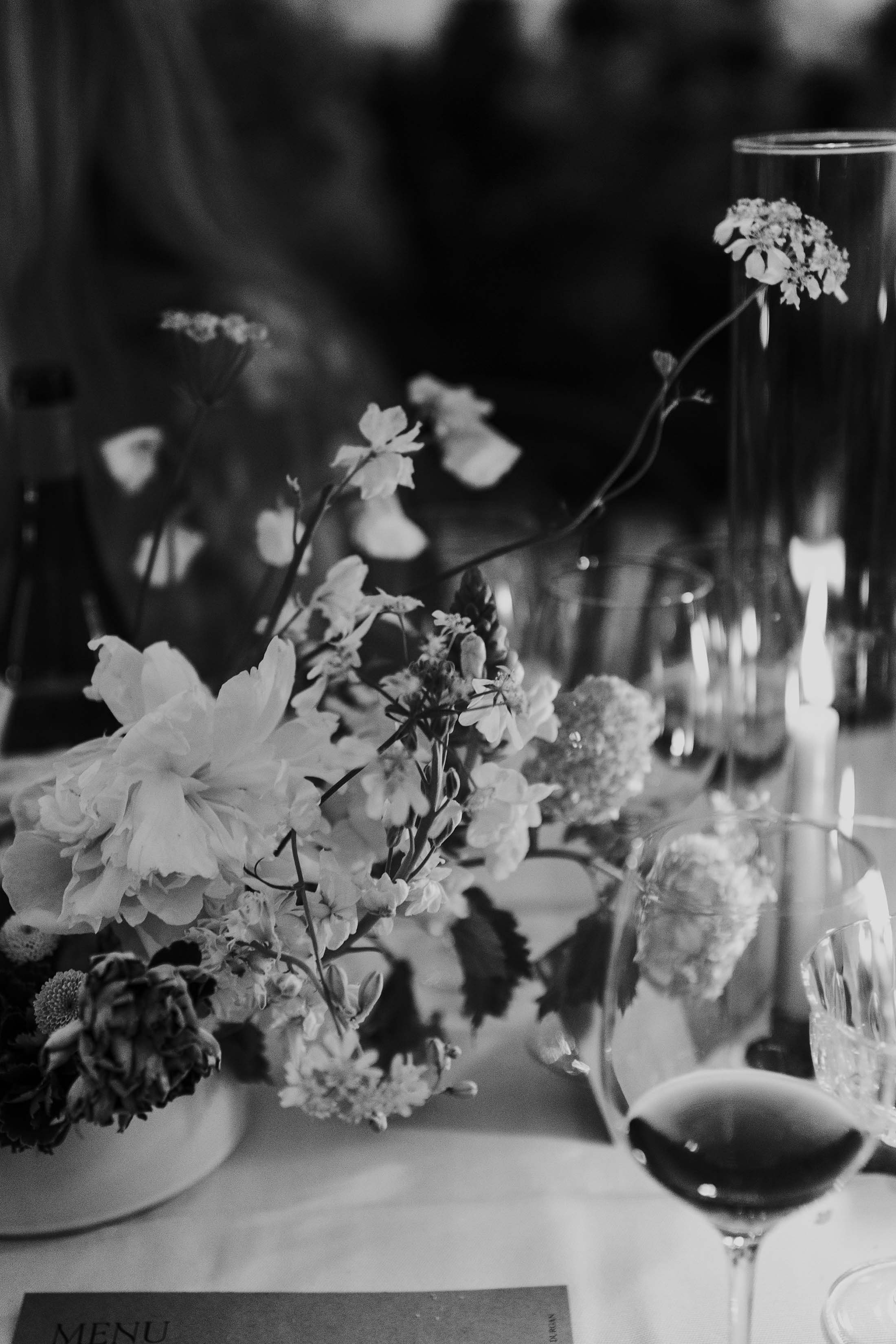 black and white photo of wedding table florals