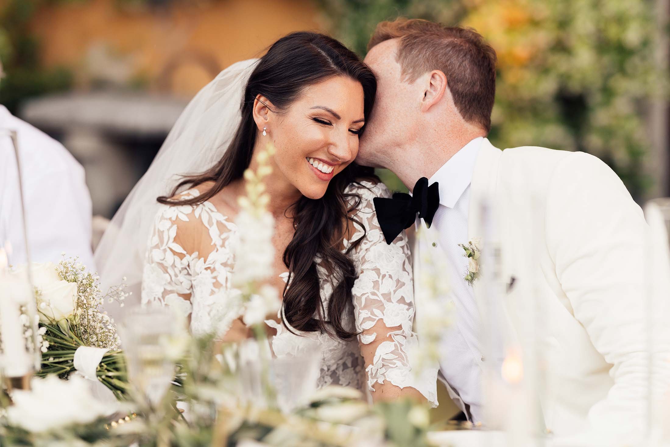 Bride and groom share kiss at italian wedding