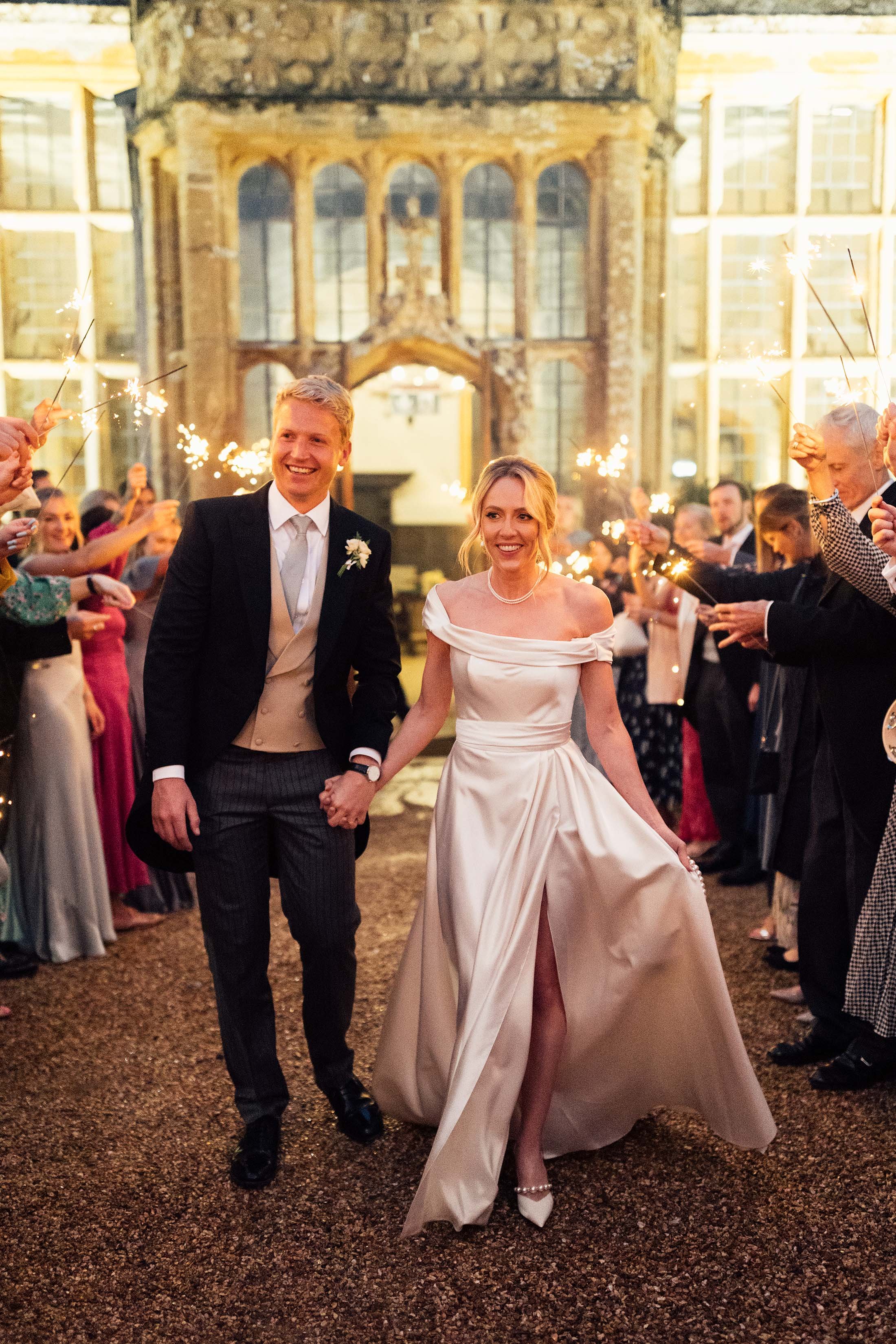 sparkler moment at brympton house with bride in halfpenny dress