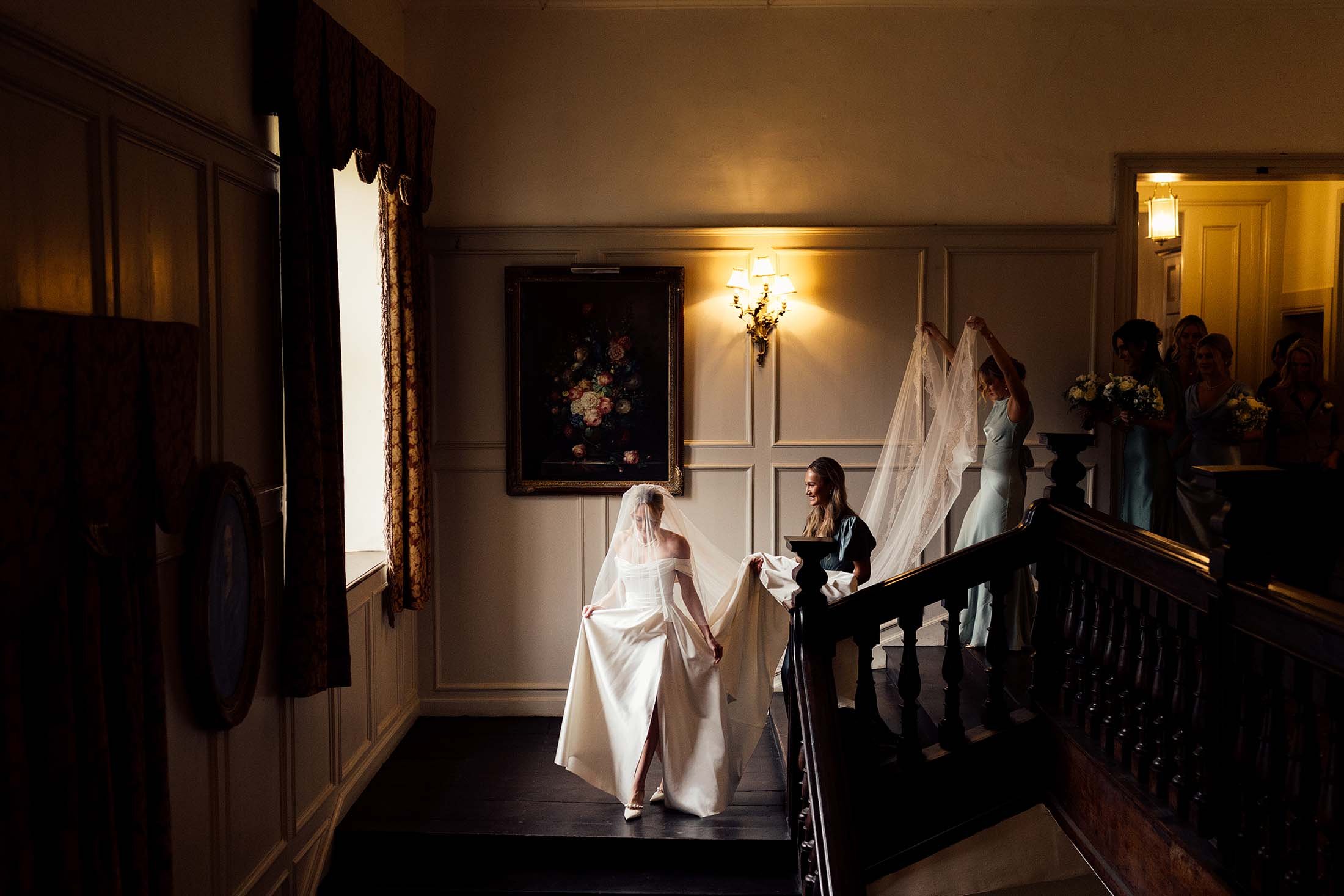 bride walking to ceremony at Brampton house chapel in halfpenny London dress