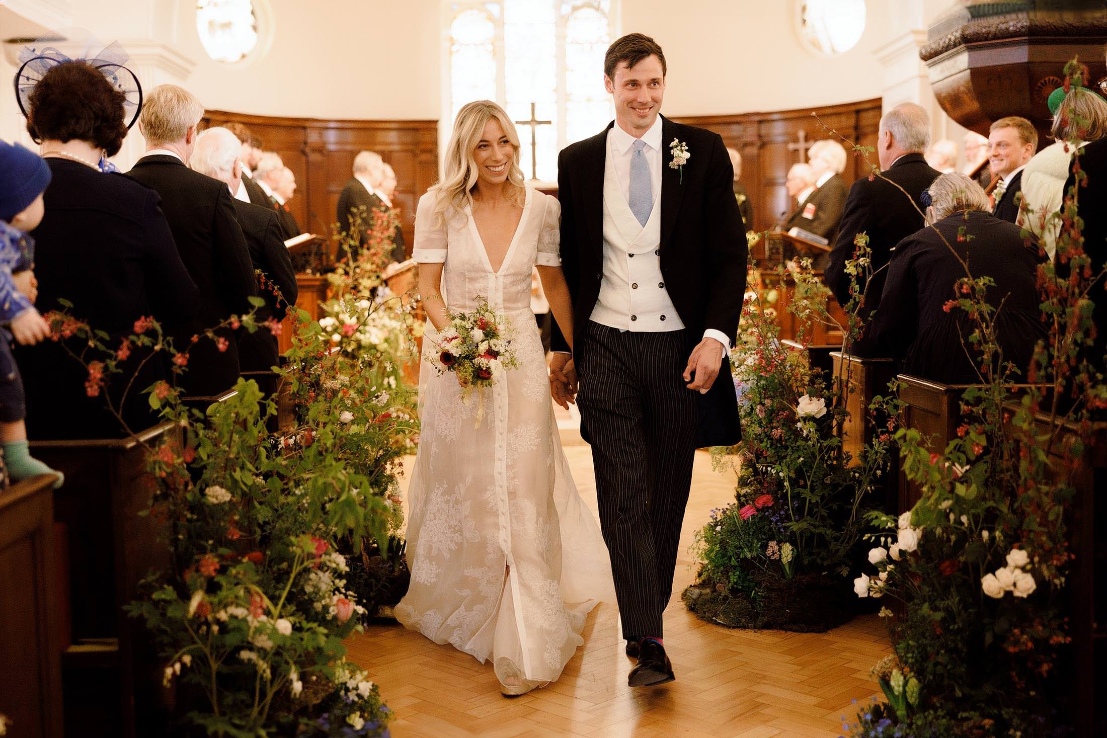 bride and groom walk down aisle for st mary's battersea church ceremony