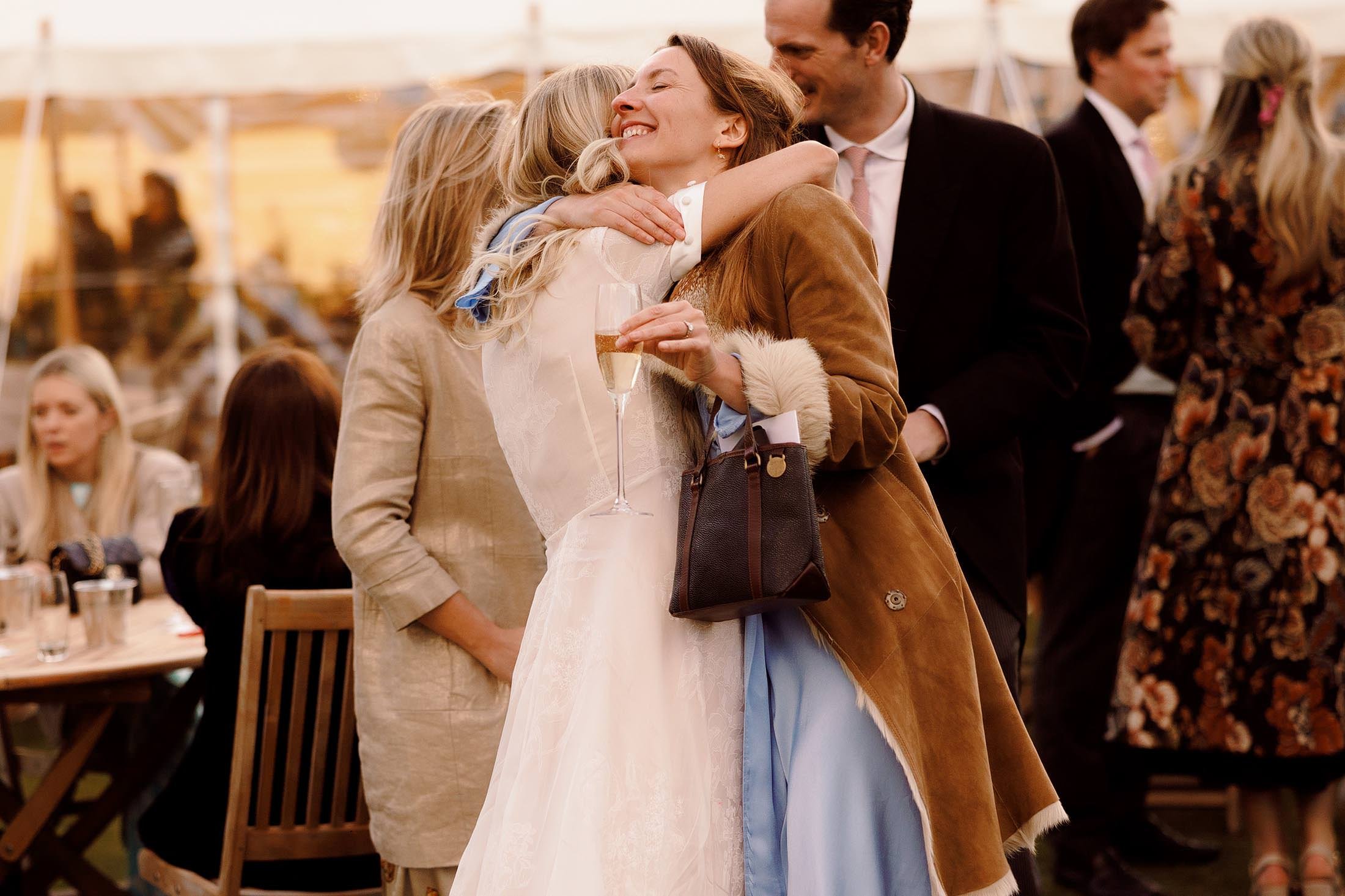 guest hugs bride at london wedding in battersea