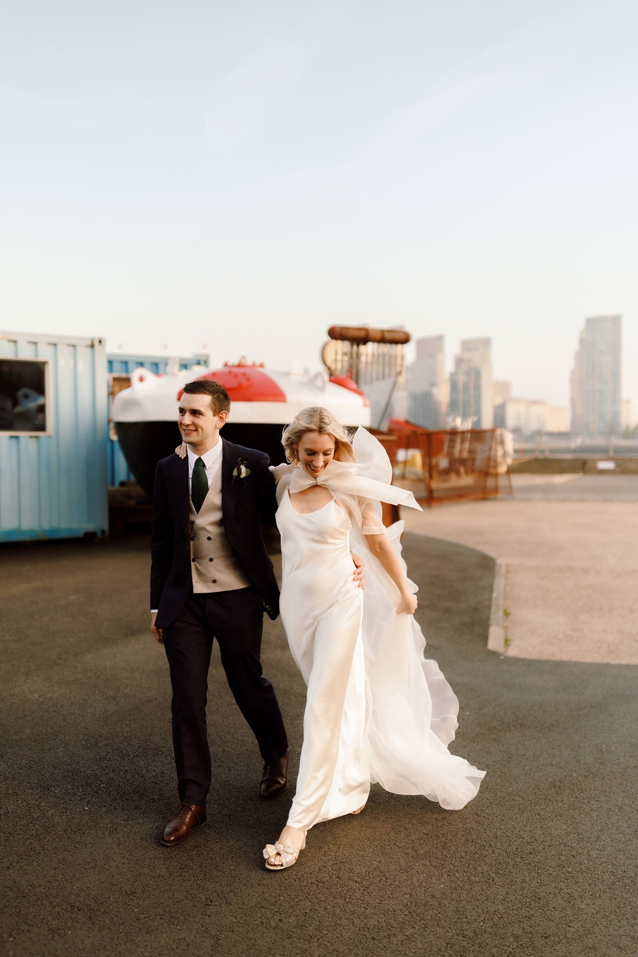 bride and groom portraits at london venue with bride in halfpenny dress