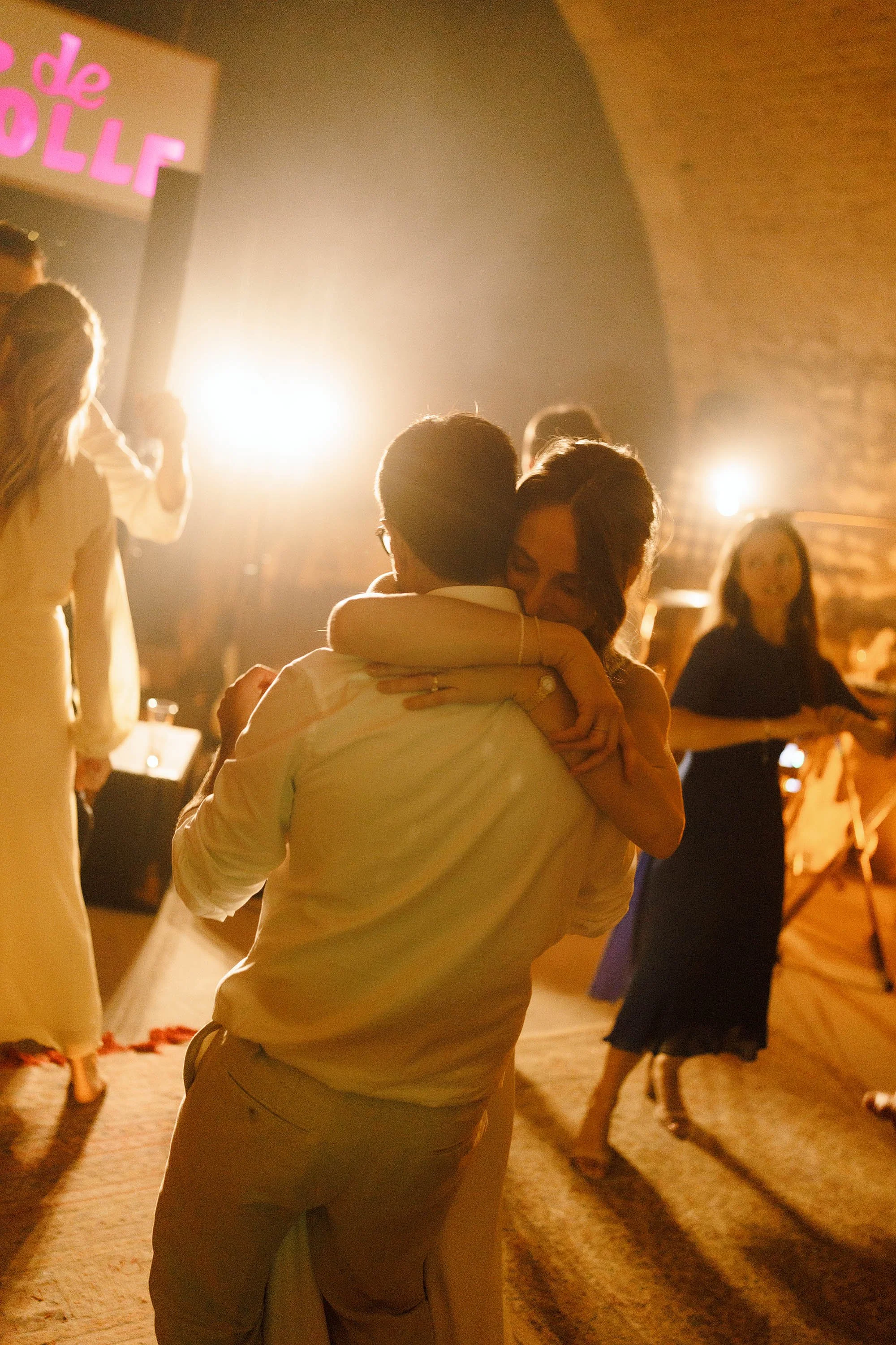 bride and groom dance in underground cave at chateau de lartigolle france