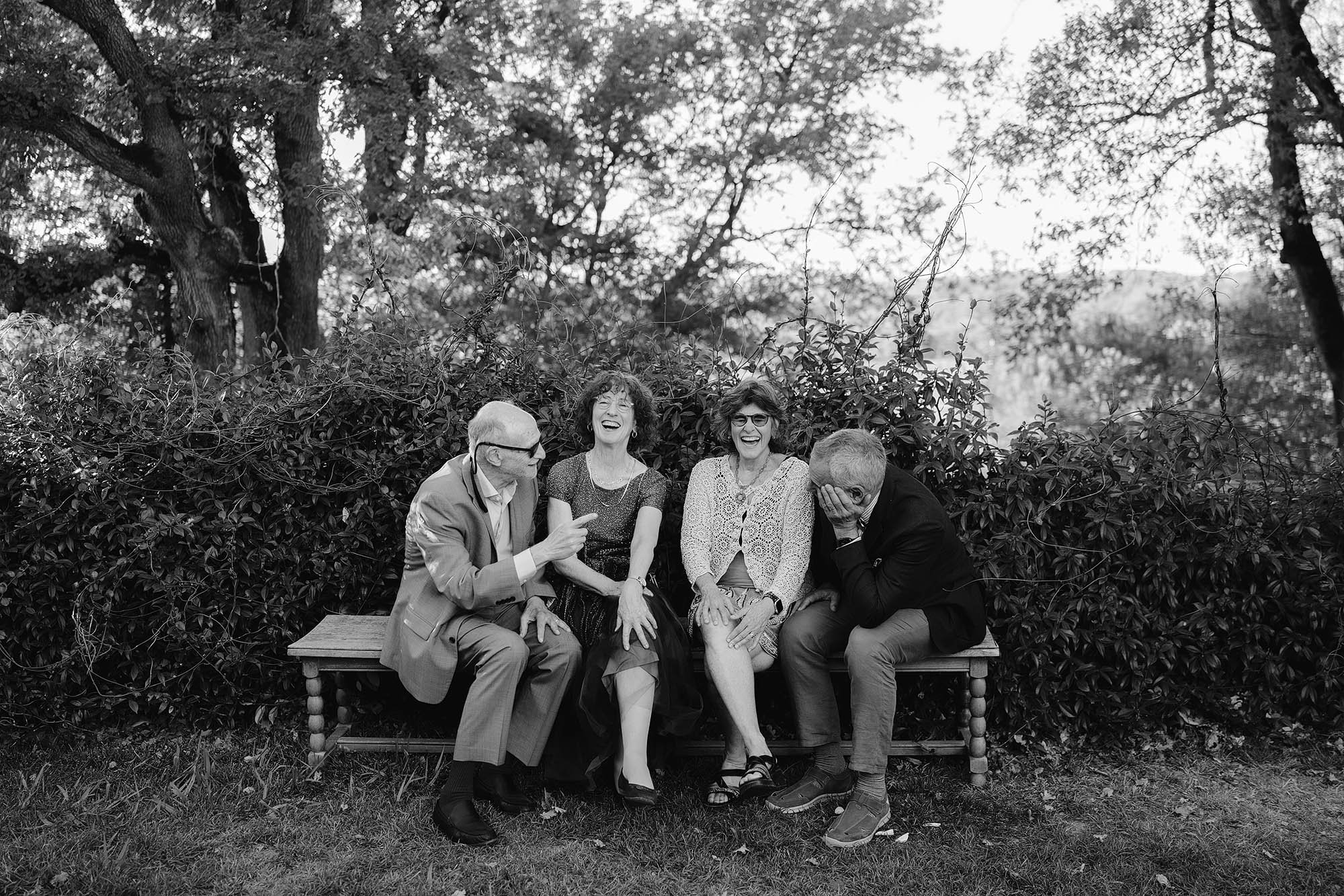 guests laugh at chateau de lartigolle wedding