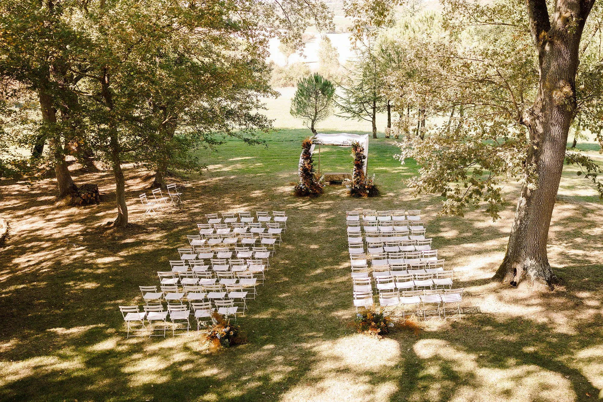 outdoor ceremony set up at chateau de lartigolle france