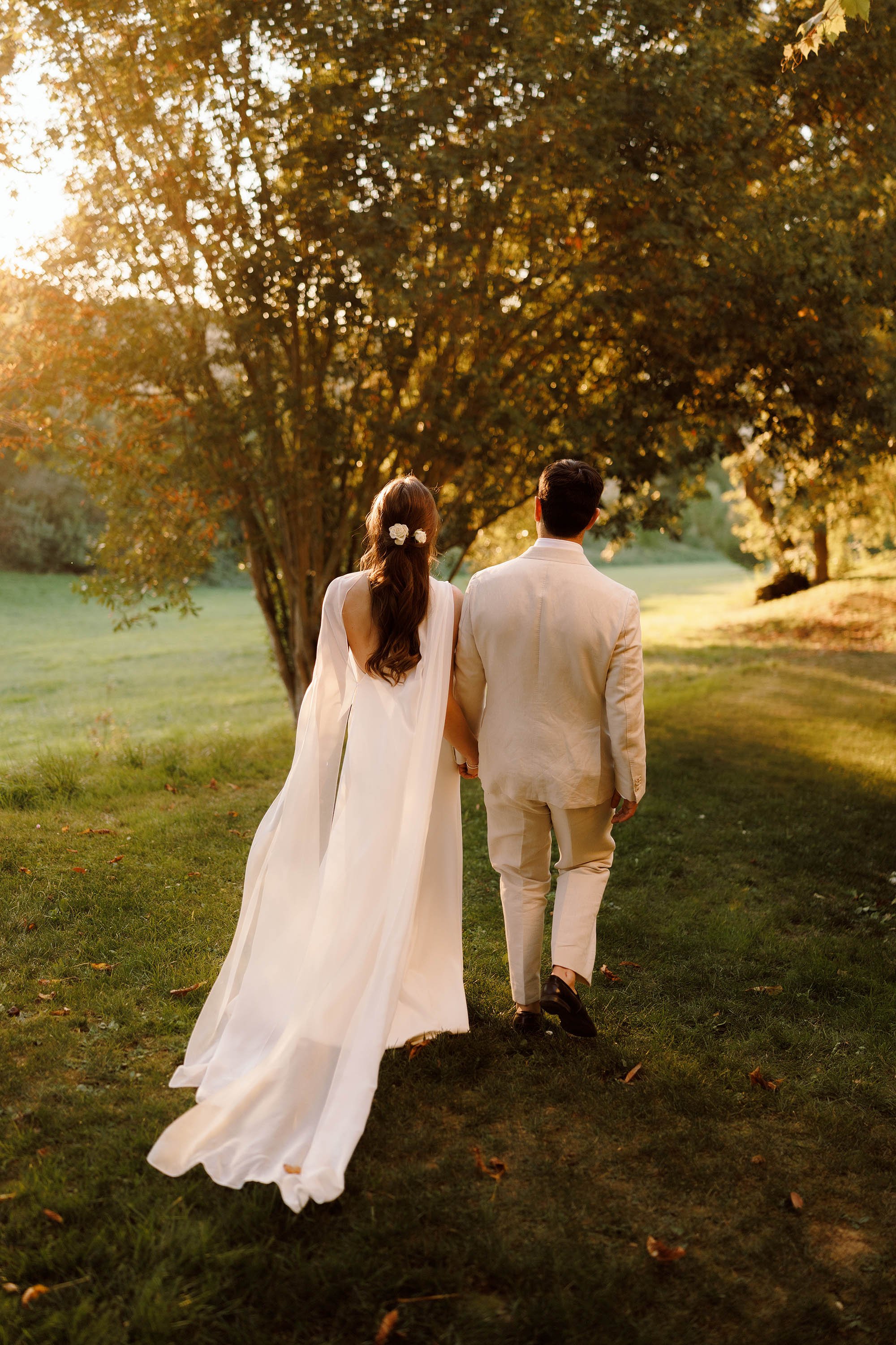 bride and groom walk to sunset in french courtryside