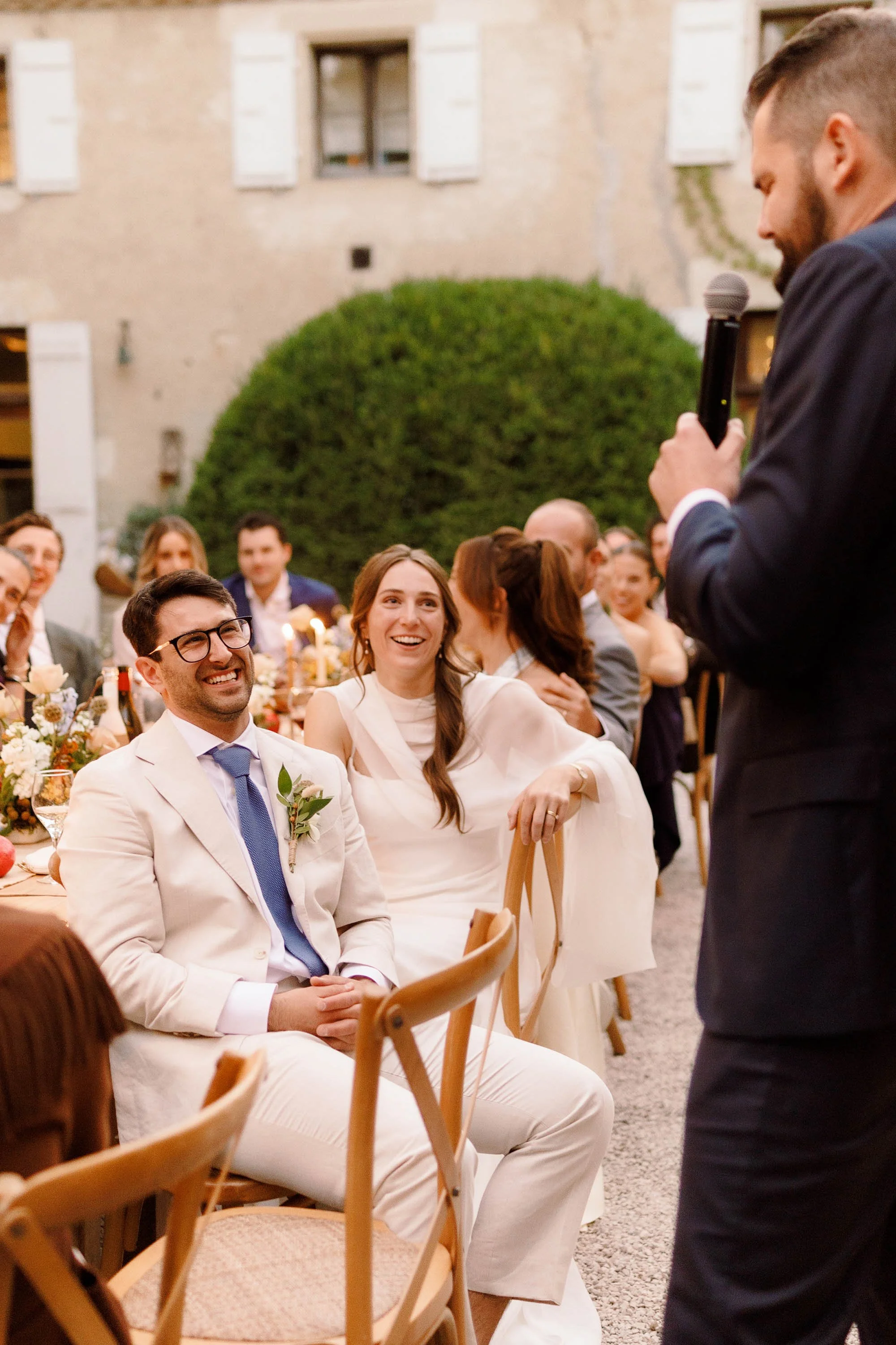 groom laughs during best man speech