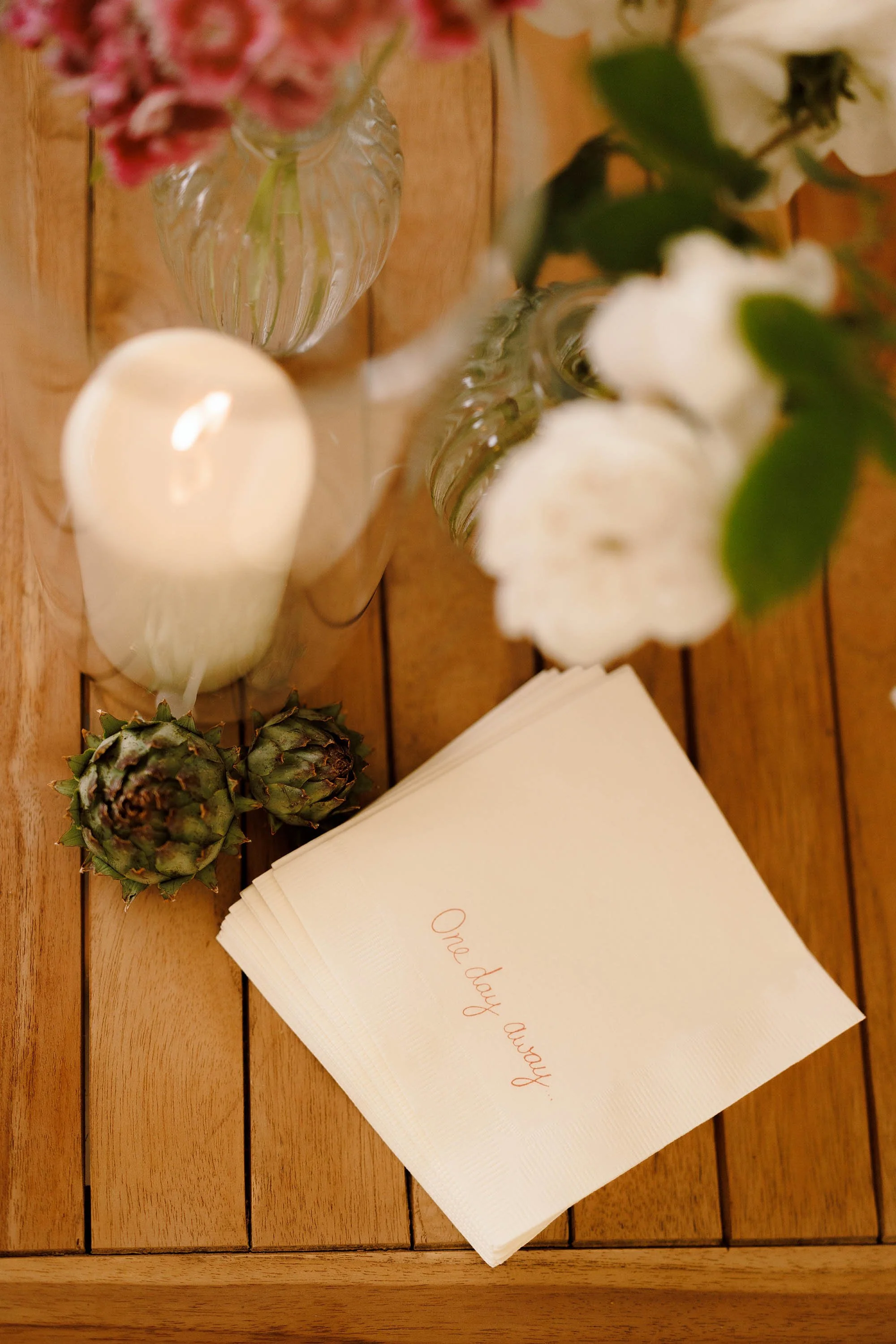 personalised "one day away" napkins at night before cocktail wedding event