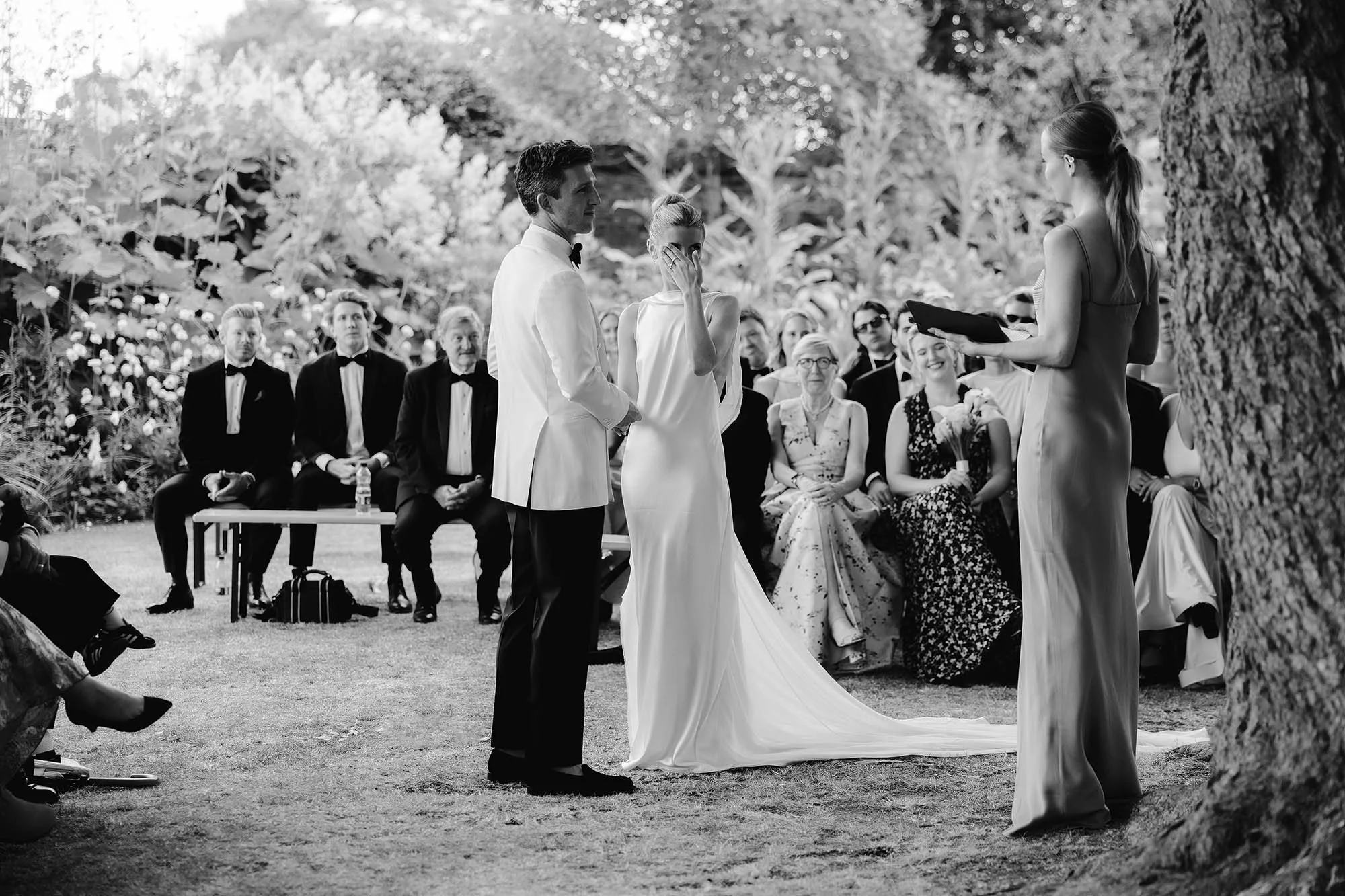 outdoor ceremony at nevill holt estate with bride in danielle frankel dress