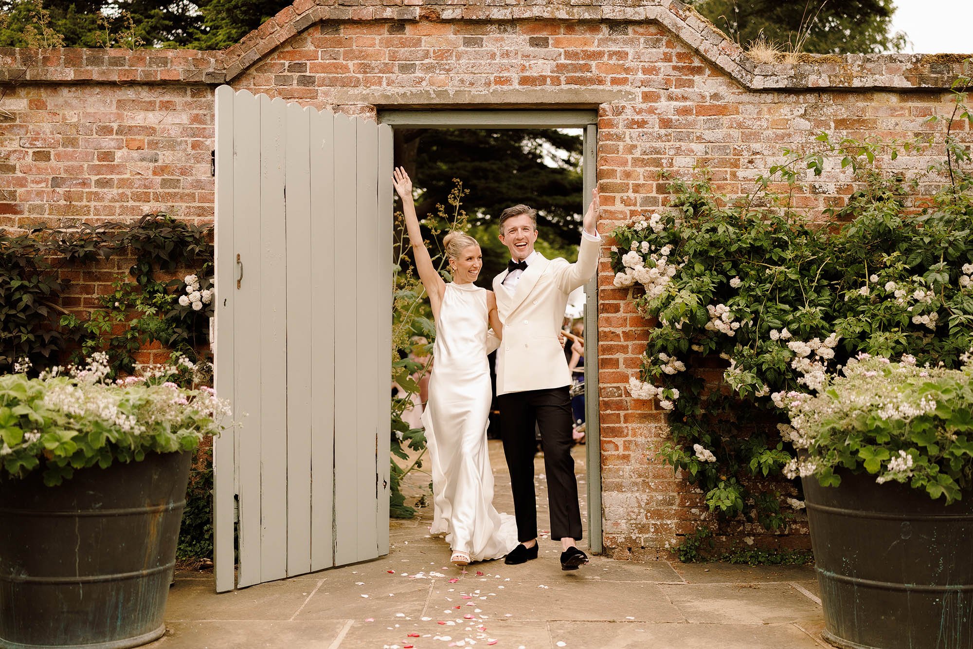 bride and groom cheer after ceremony