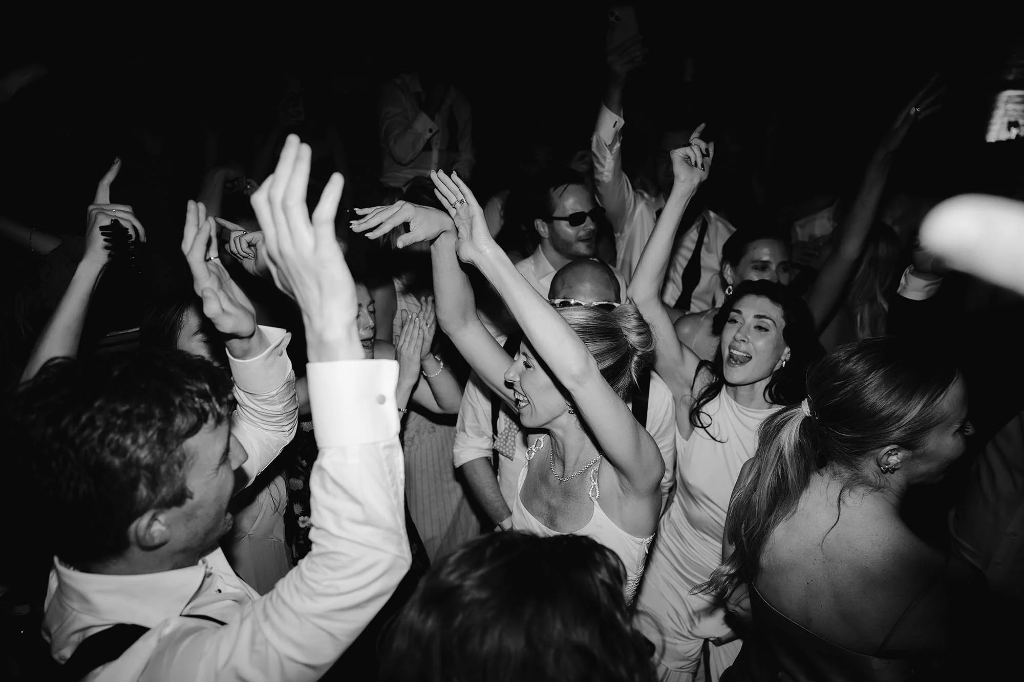 packed dancefloor with bride in the centre