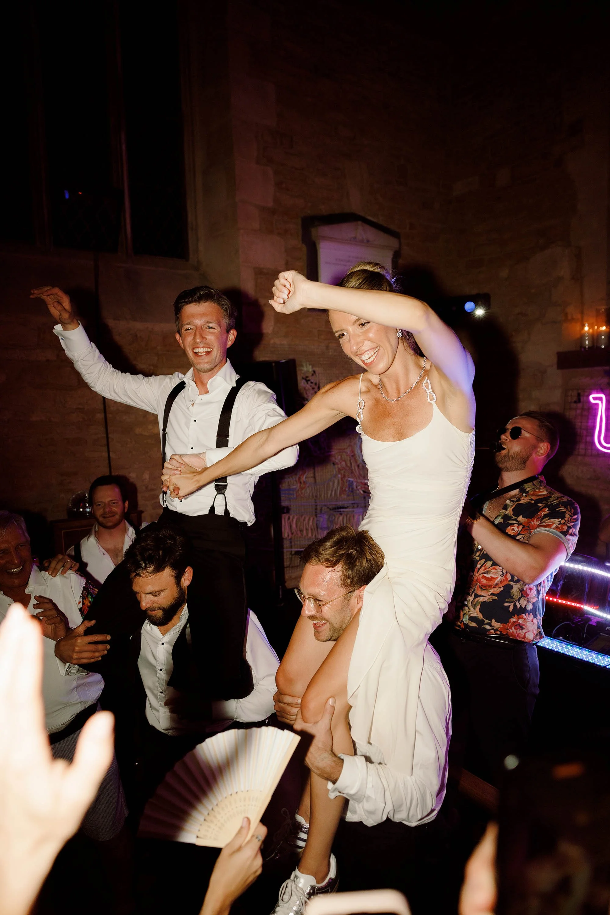 bride and groom lifted on dancefloor at nevill holt wedding