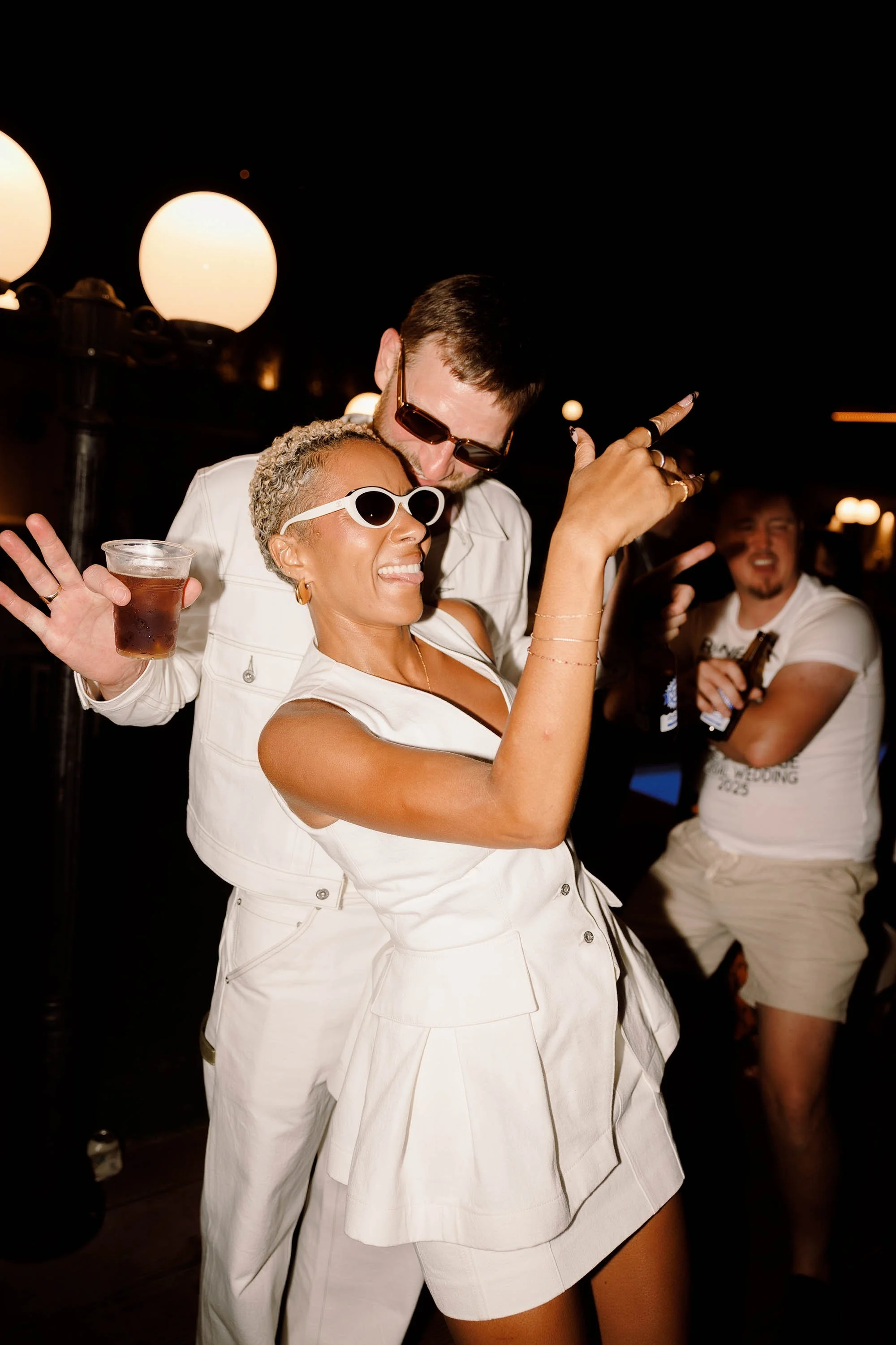 bride and groom party in custom levi's outfits