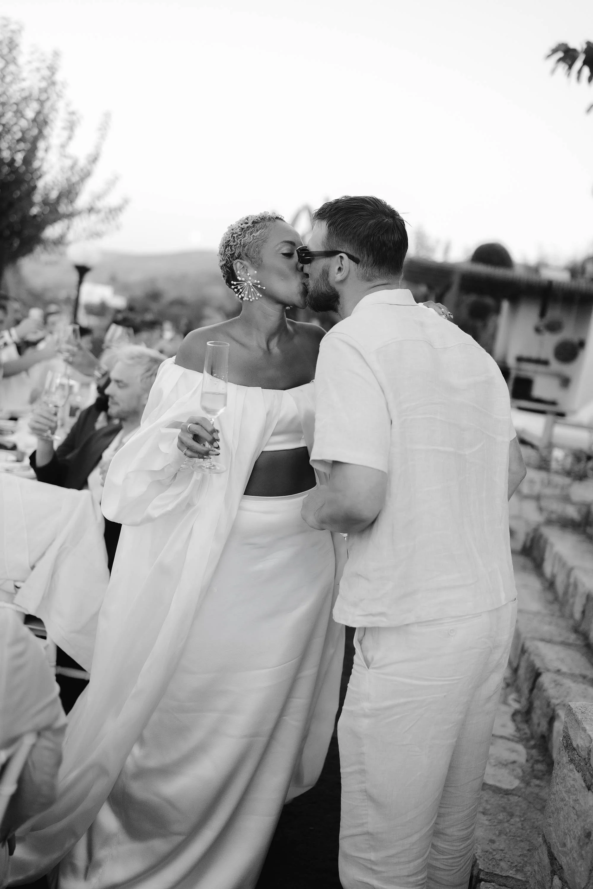 bride and groom share a kiss at greece destination wedding