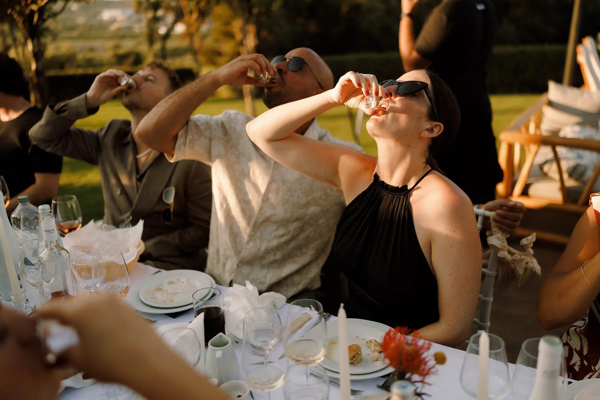 guests drink shots for crete wedding