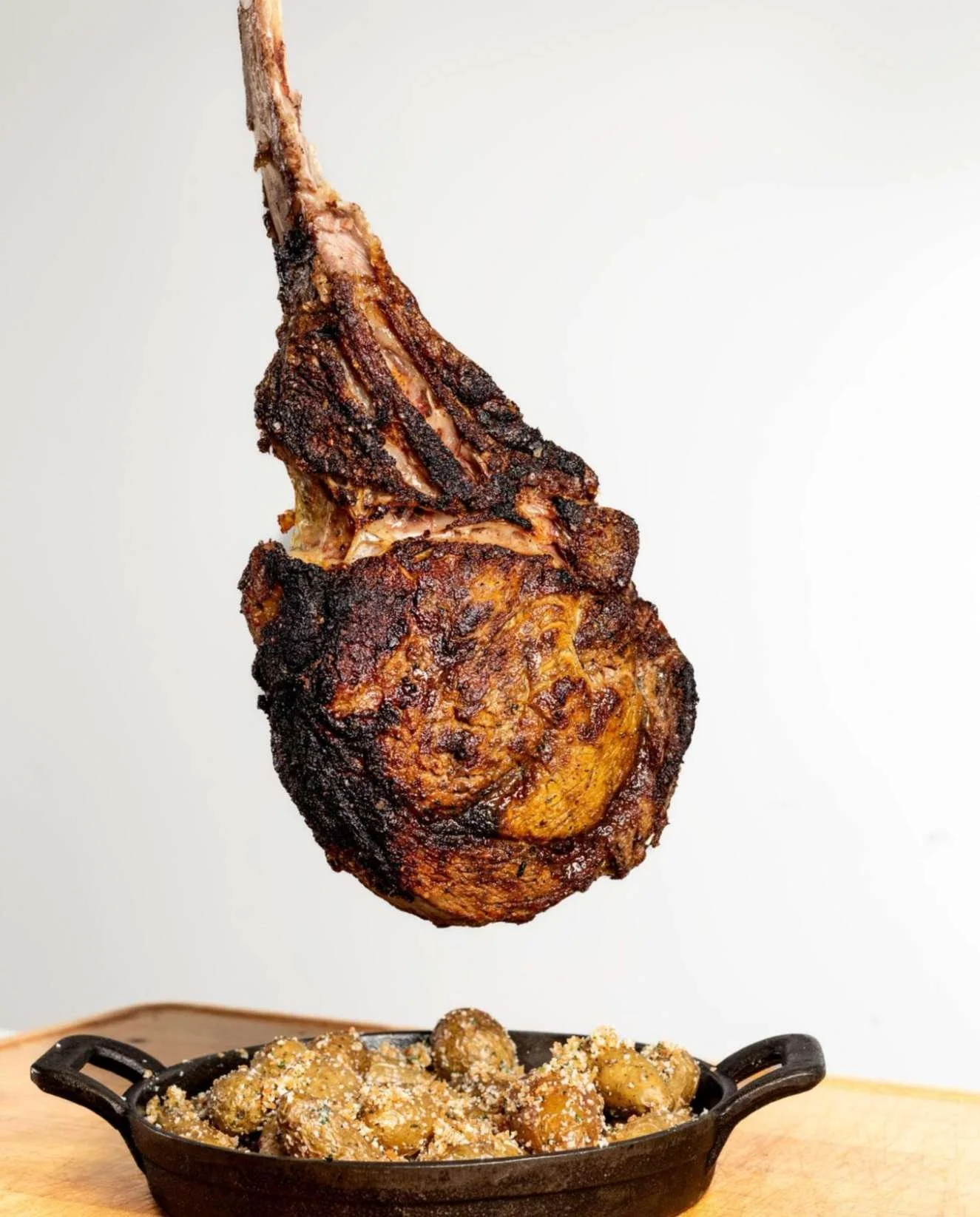 What we bring to the table&hellip;

HANGING TOMAHAWK FOR TWO:
50 oz. Prime, Sliced Tableside
parmesan and butter breadcrumb-crusted fingerling potatoes, dry-aged beef tallow, and roasted garlic butter