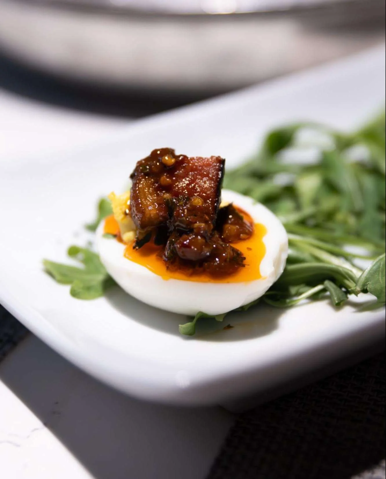 Deviled to perfection: A little sinful. A lot delicious. Every bite teases, tempts, and totally delivers. Discover the taste of Pork Belly Deviled Eggs, available only at Social Hour.