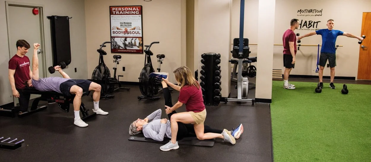 Body Soul Training trainers working one-on-one with clients during strength, mobility, and personal training sessions in Providence, Rhode Island.