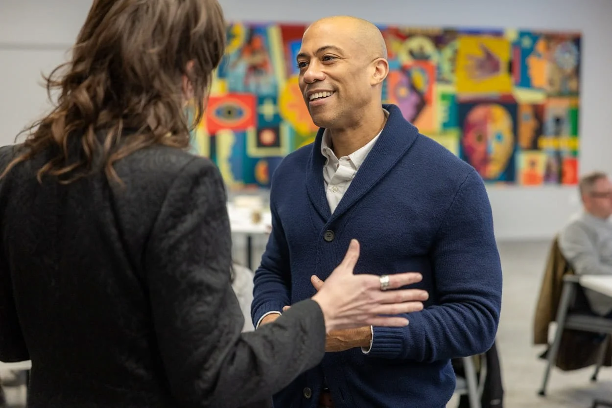 Cheo speaking with a medtech professional during a video and photography project at the Midtown Collaboration Center in Cleveland, Ohio.