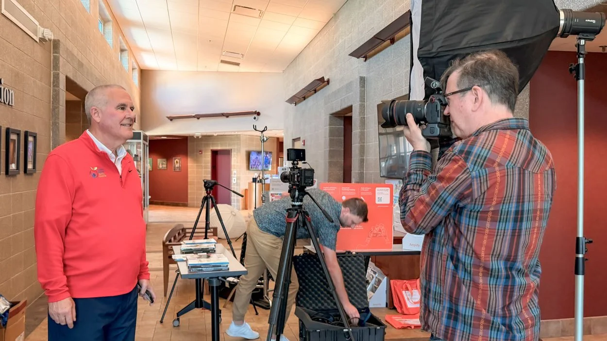 Behind the scenes of a business photography and video project with a team capturing content for a website and marketing