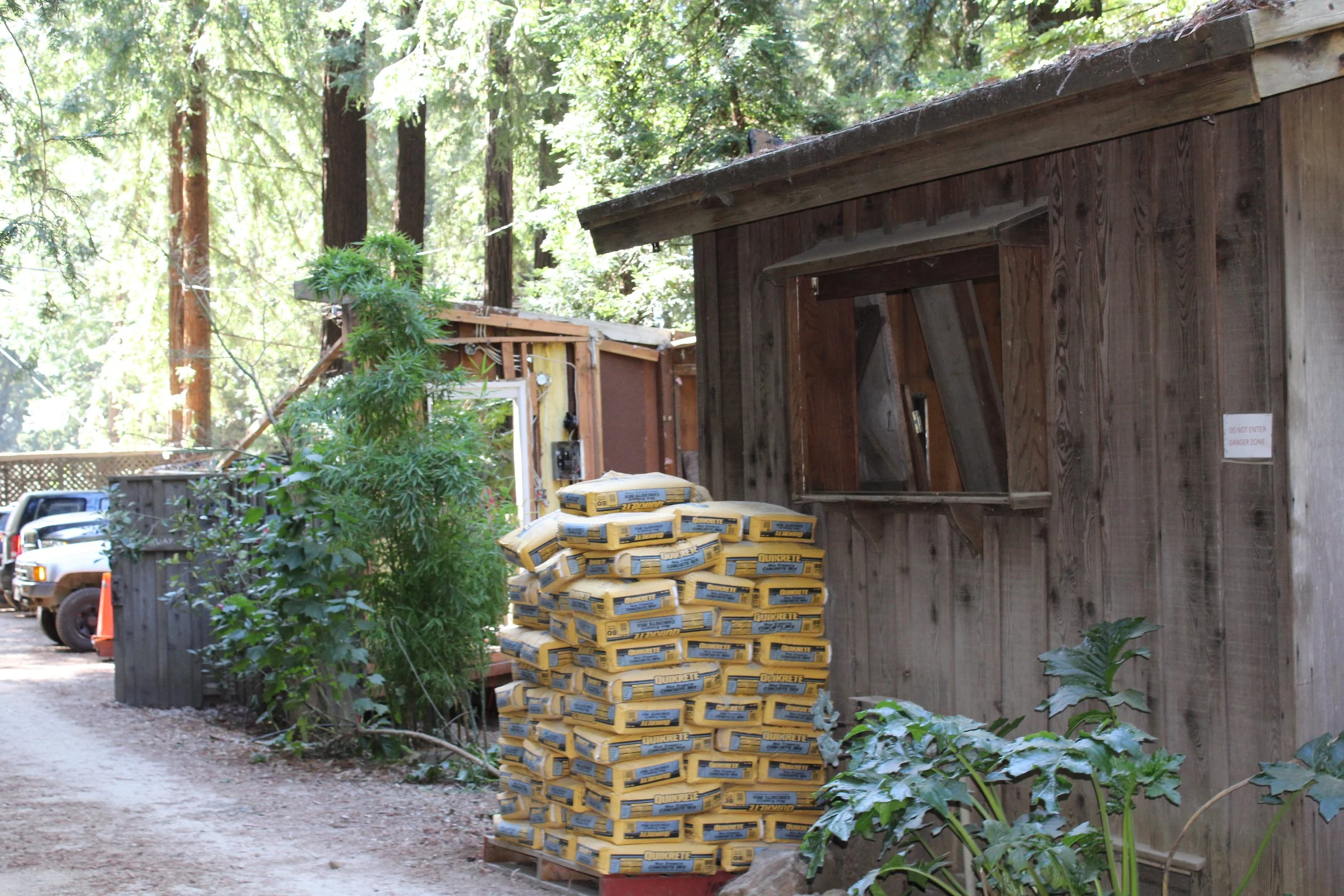Sacks of concrete outside damaged building