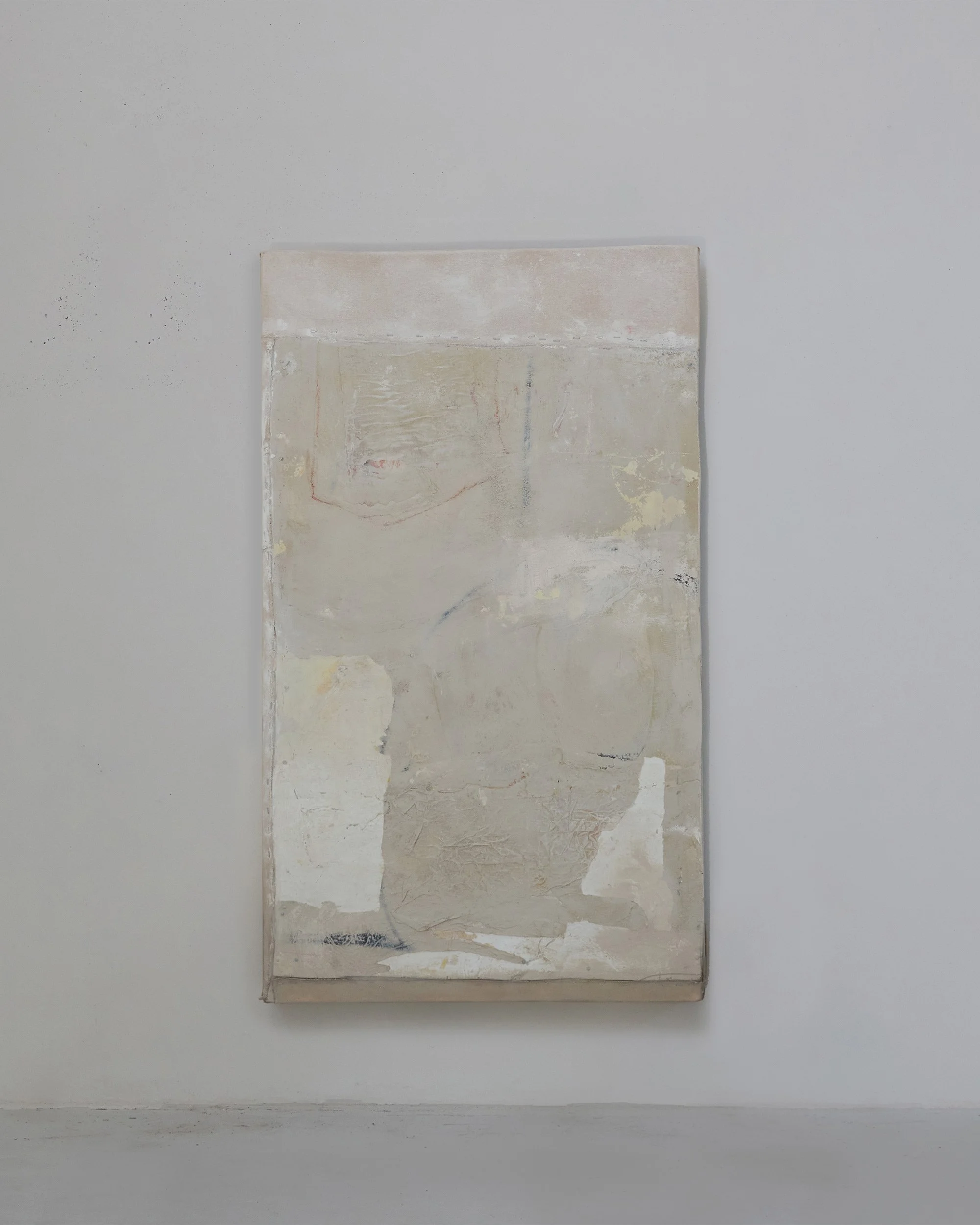 untitled, 2025, oil, wax, house-paint, paper, canvas and staples on board, 119 x 70 x 11cm
