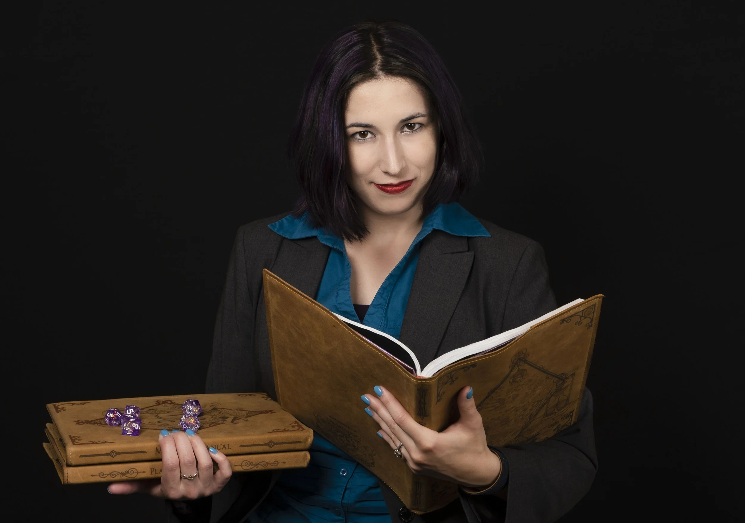 Woman with three RPG books