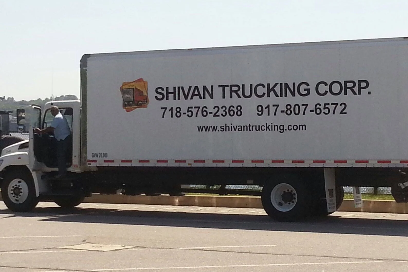 Oranssi technician working on a roof project