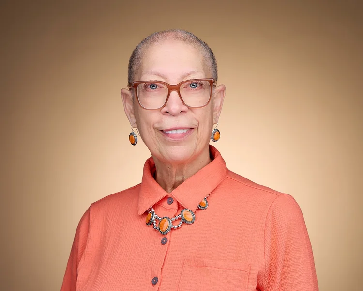 Warm professional headshot of a woman in Tucson photography studio