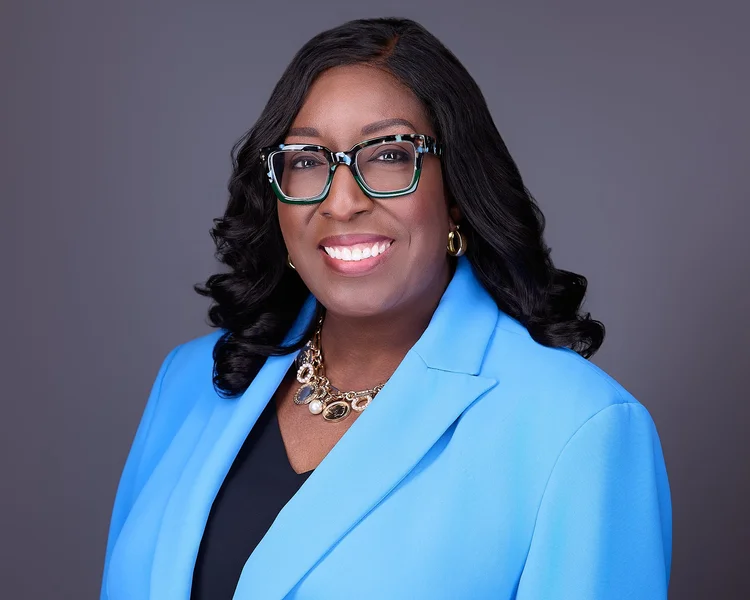 Corporate headshot of a woman in a blue blazer by Tucson headshot photographer