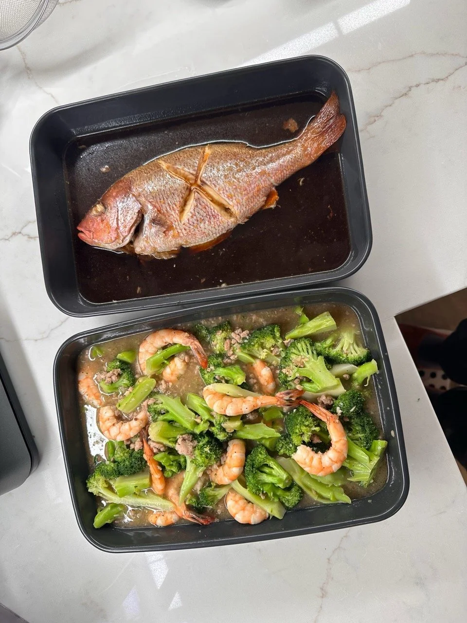 Braised red snapper, shrimp and broccoli in white sauce