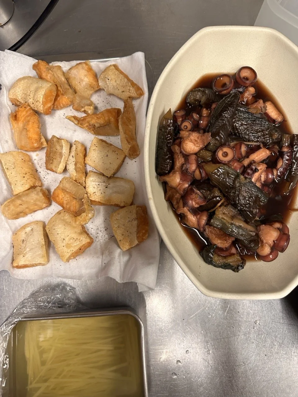 From the left, fried salmon belly, octopus and eggplant braised in soy sauce and ginger