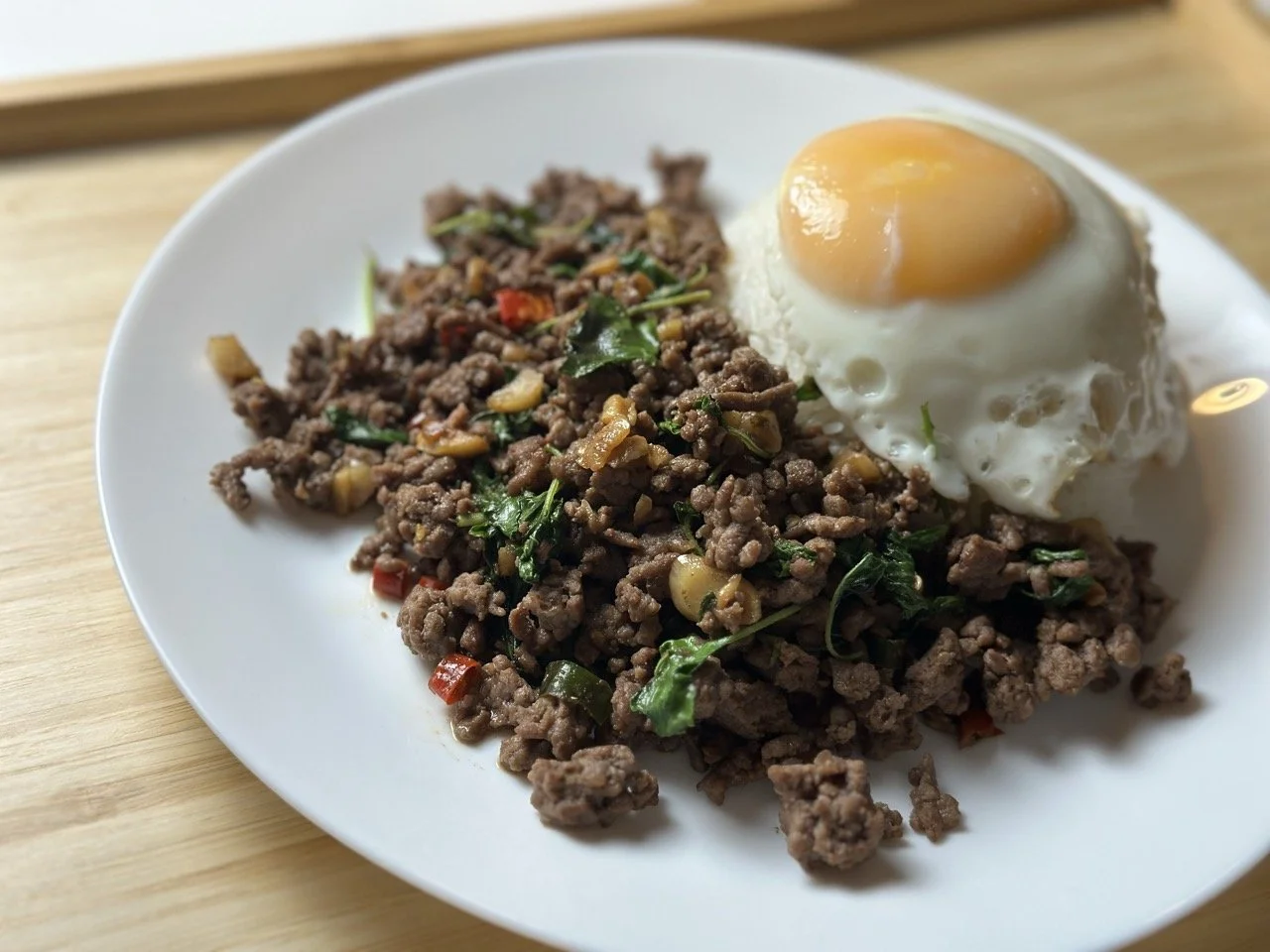 Pad Ka Prao Nuea (Beef Holy Basil Stir-Fry served with Runny sunny-side-up over Jasmine rice)