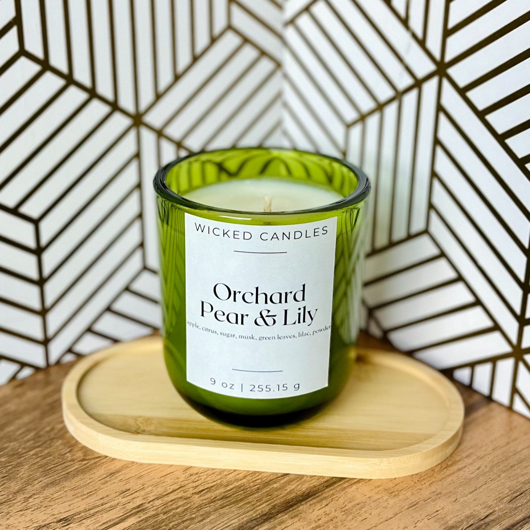 Orchard pear and lily scented 9 oz candle. Hand poured with vegan soy wax and non-toxic fragrance oil.