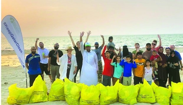 Qatar beach cleanup, with volunteers and collected litter