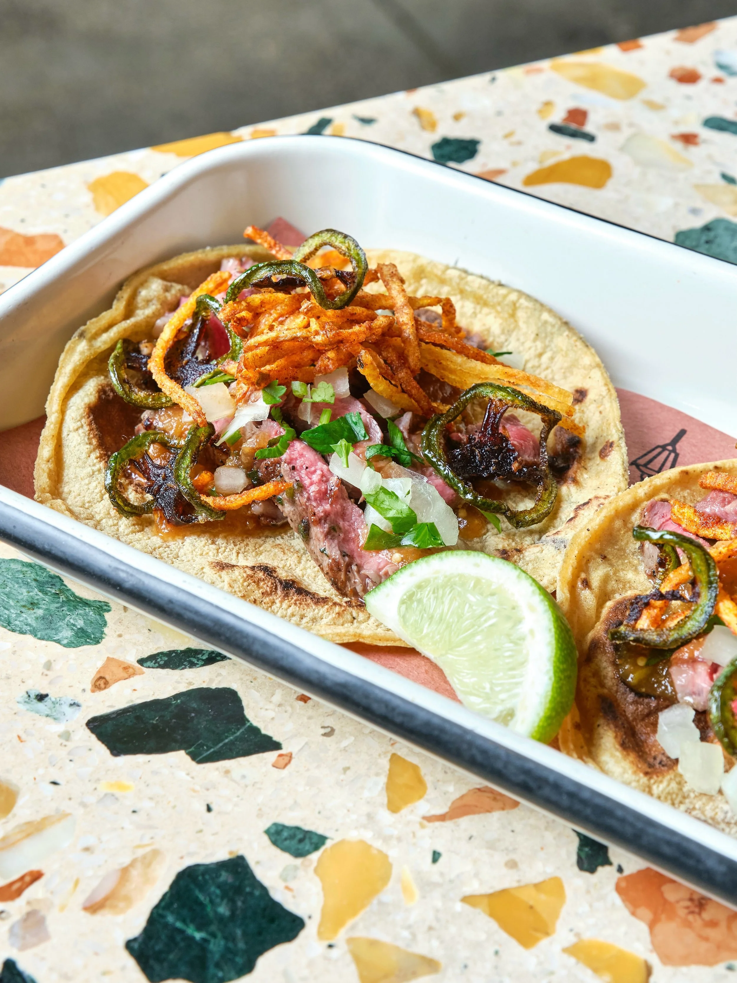 Our fan-favorite ribeye tacos are back for #TacoTuesday in June! Wood-grilled ribeye, papitas, jalape&ntilde;o, chicharr&oacute;n, salsa borracha + more, all wrapped up in warm corn tortillas. 

Plus, enjoy $10 off classic pitchers every Tuesday this