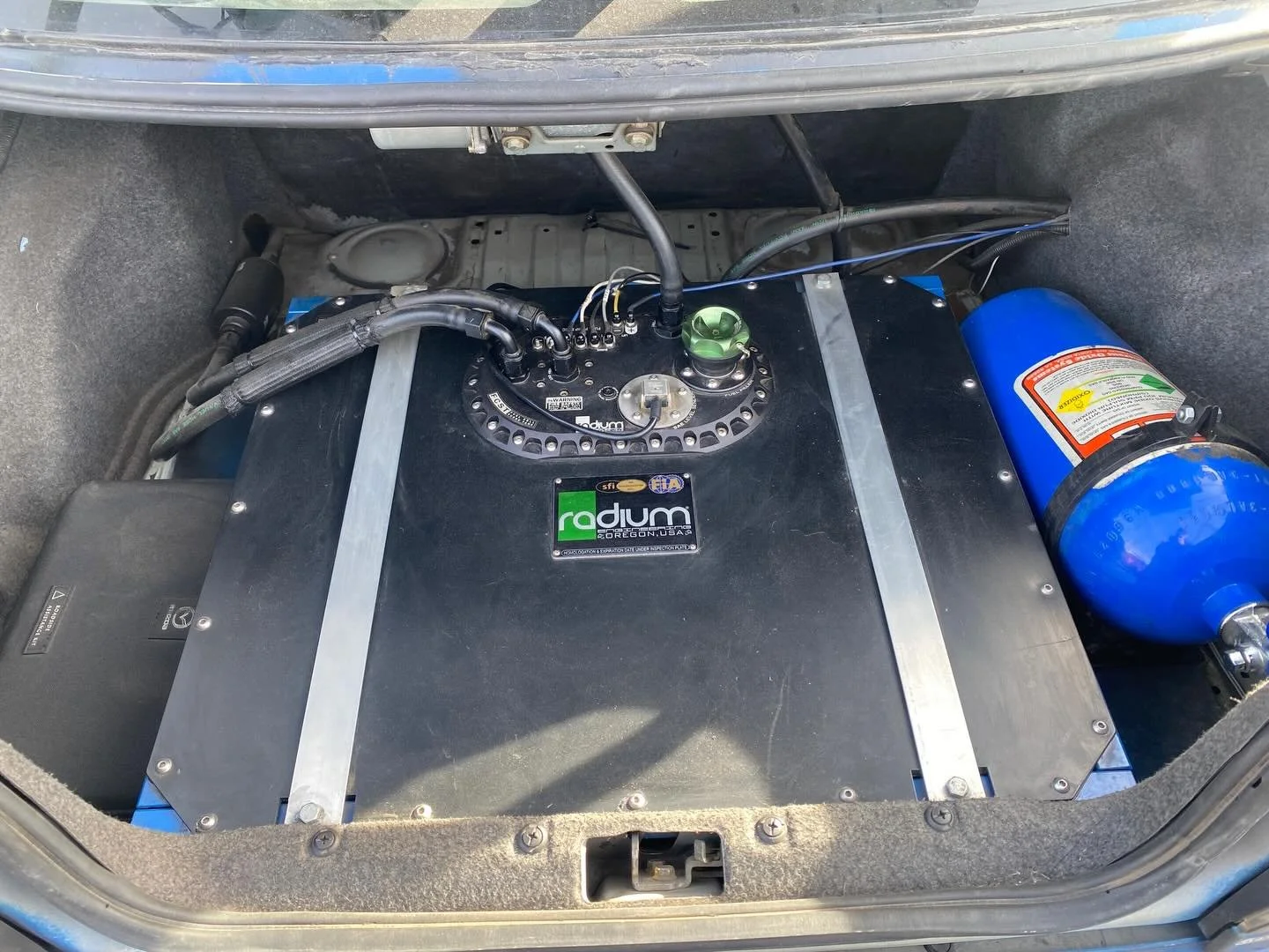 Race-ready fuel system upgrade 🔥

Finished up a custom fuel cell install in this Subaru &mdash; clean trunk layout, secure mounting, and proper plumbing done right.

When it comes to performance builds, details matter.

Would you run a trunk-mounted