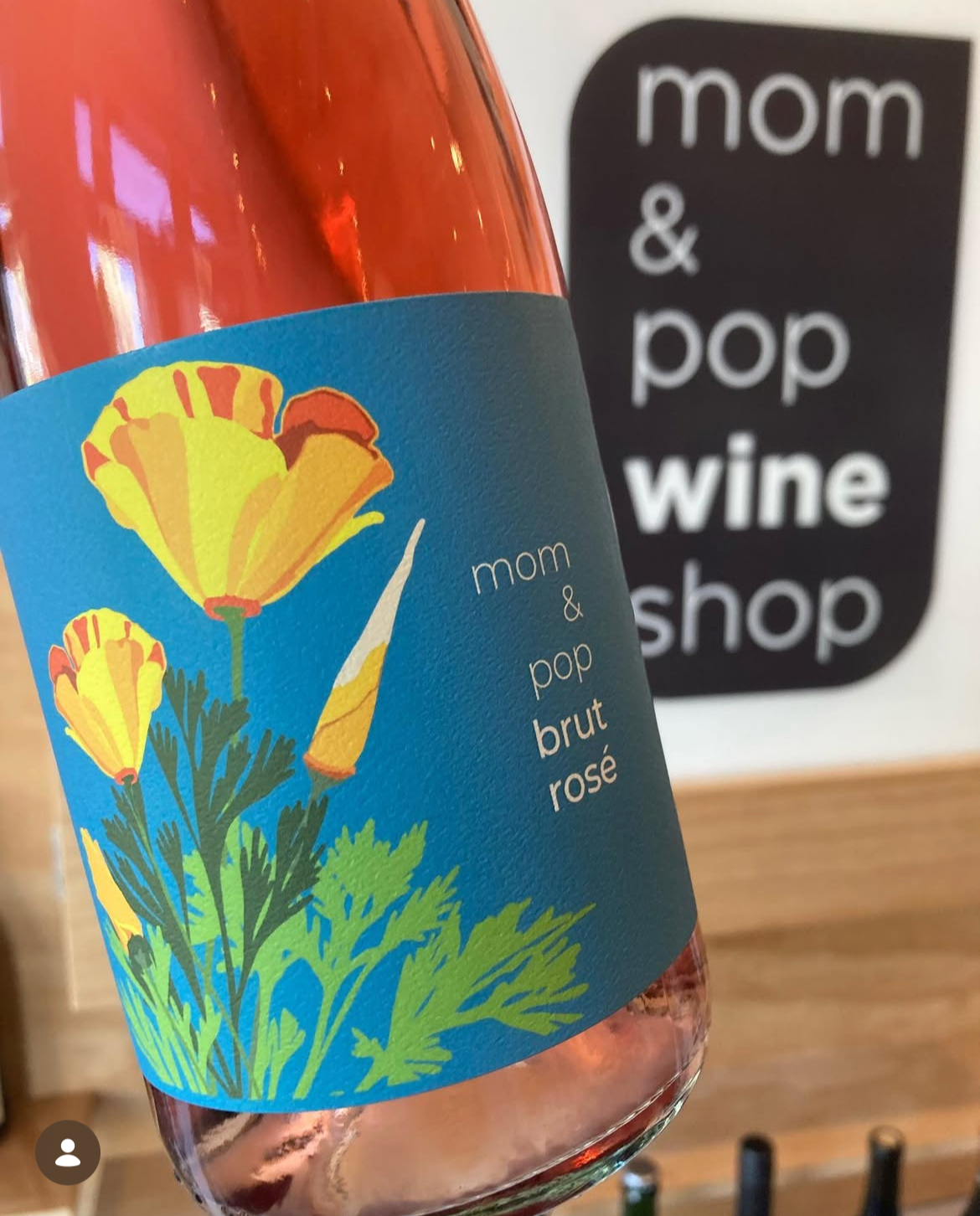 wine bottle with custom illustration of california poppies on the label
