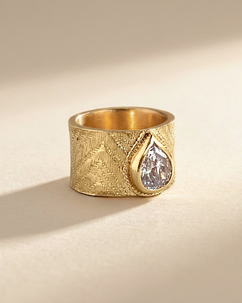 Textile imprinted gold wedding band handcrafted in studio by Emma Calvert