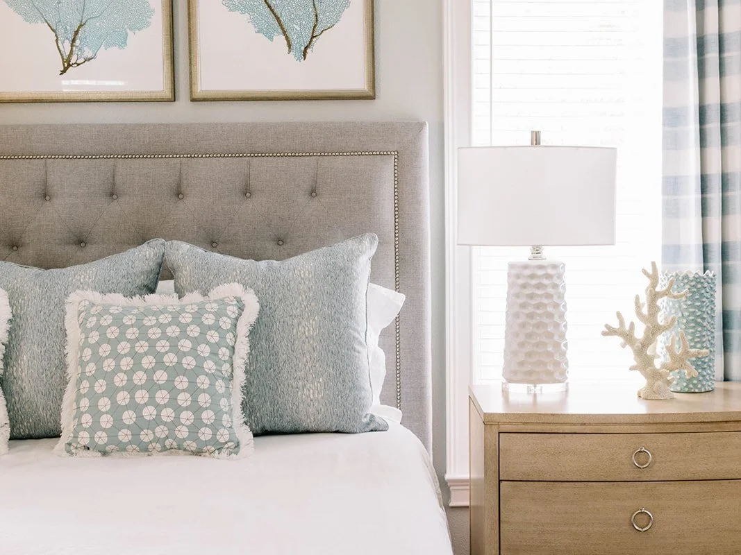 close up of pillows on bed at a newly designed Florida beach house