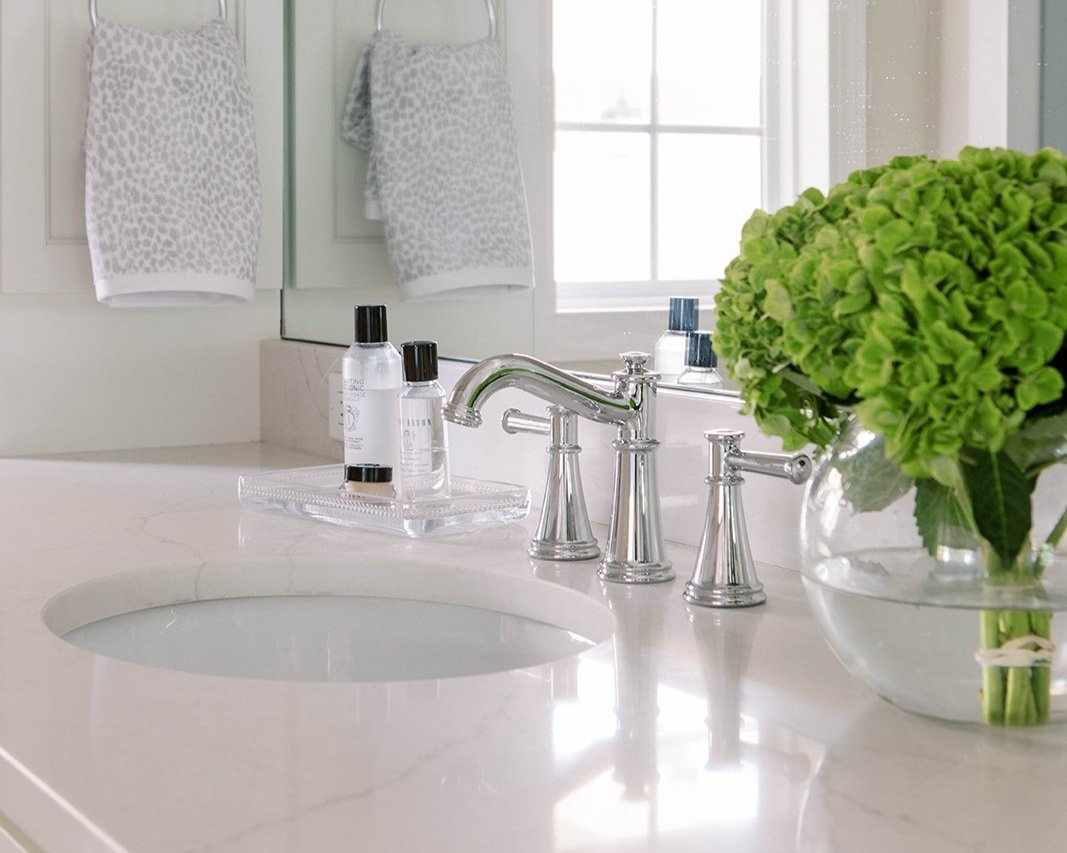 close up of sink in white bathroom design