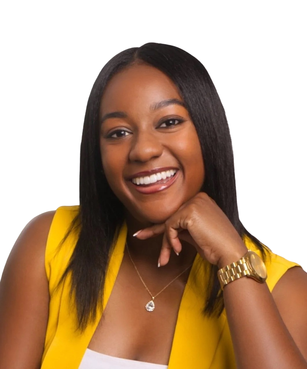 Smiling person with curly hair wearing a yellow top and gold necklace