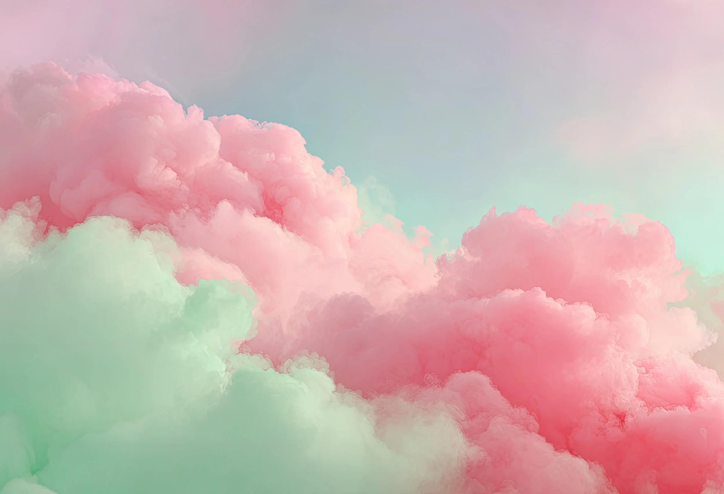Colorful pastel clouds in pink, green, and blue hues against a soft sky background.