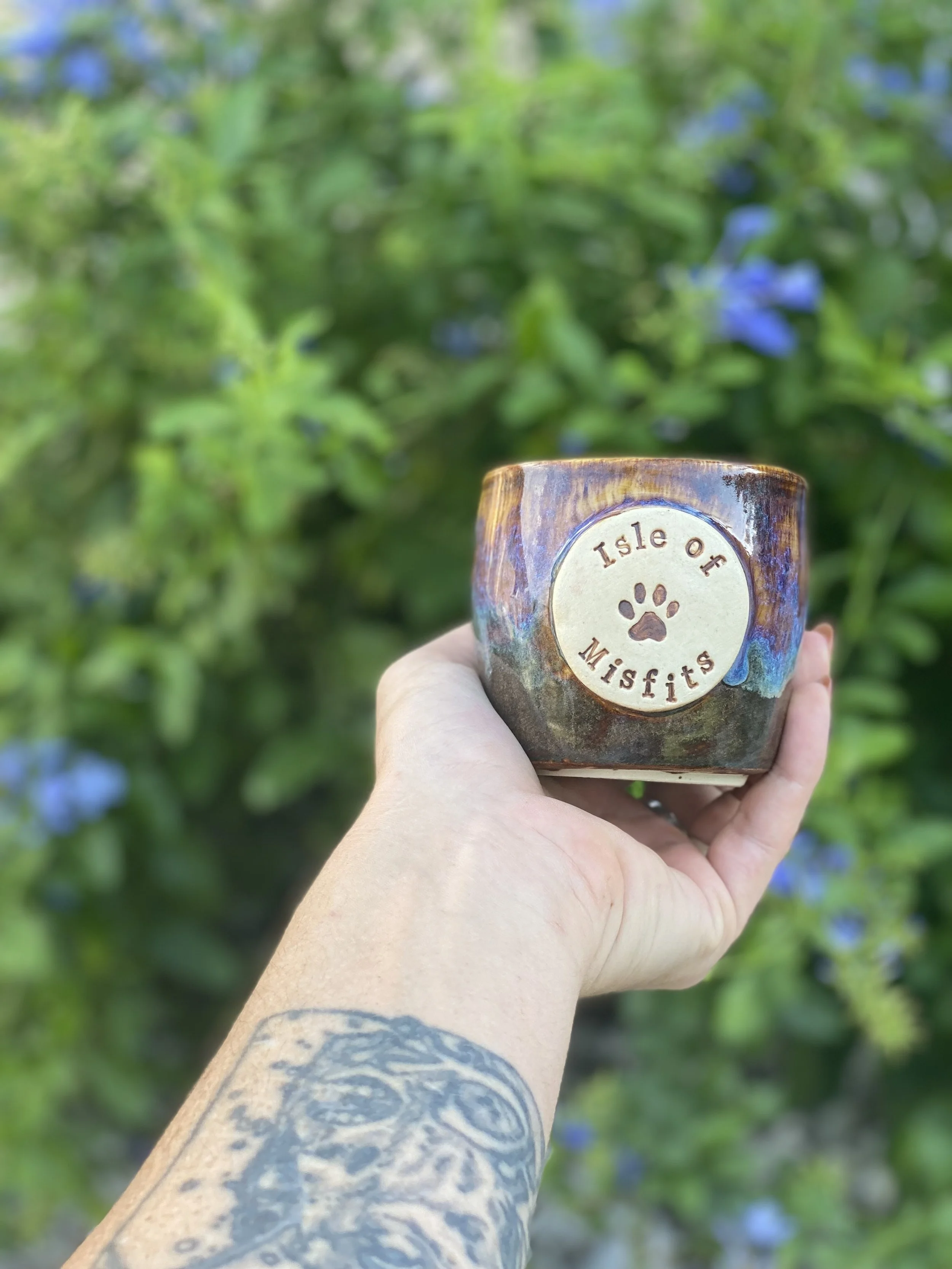 Iridescent earth-toned ceramic pot