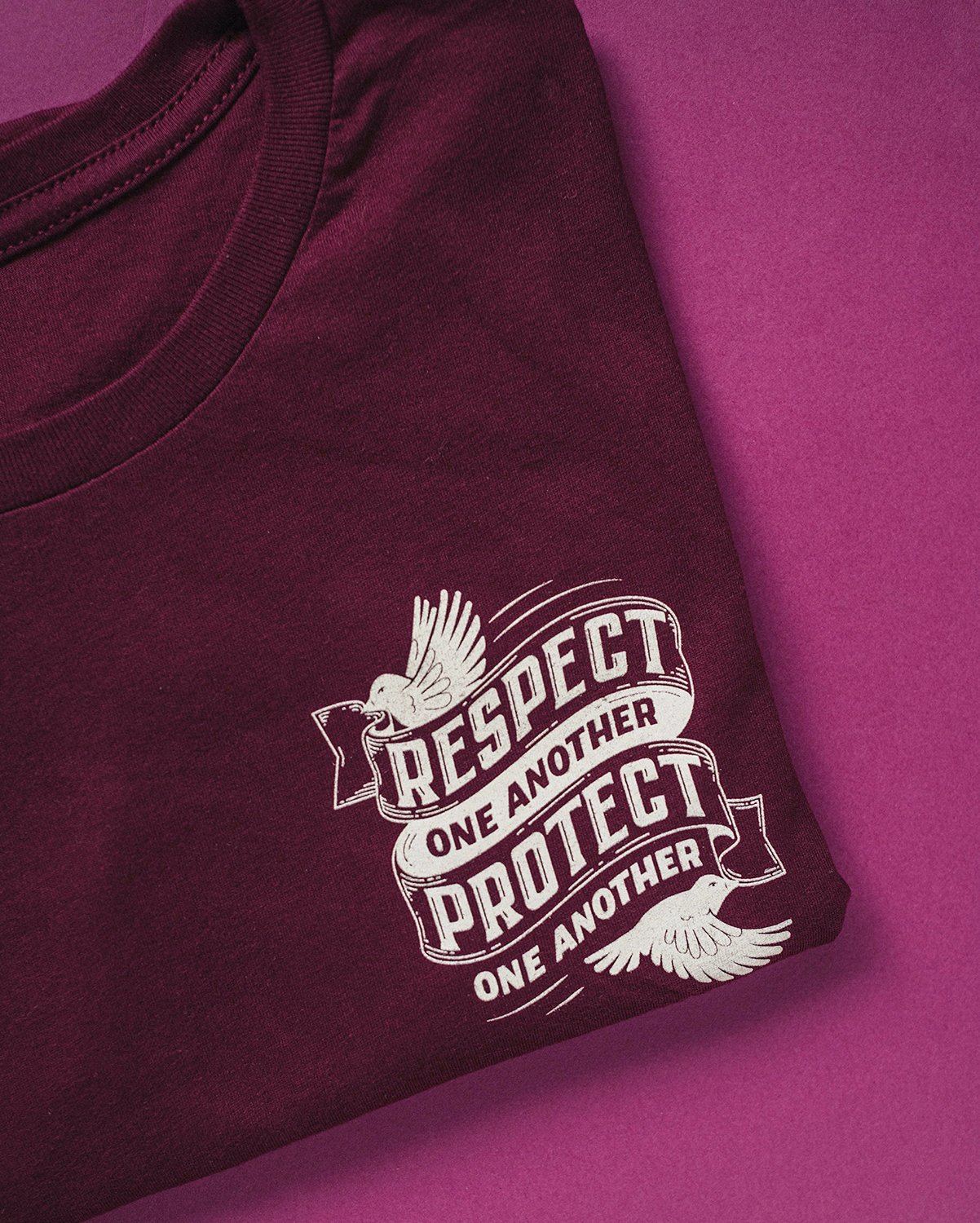 Front of folded "Respect and Protect" t-shirt by Kristle Marshall for the Herbivore Clothing Social Justice Fundraiser.