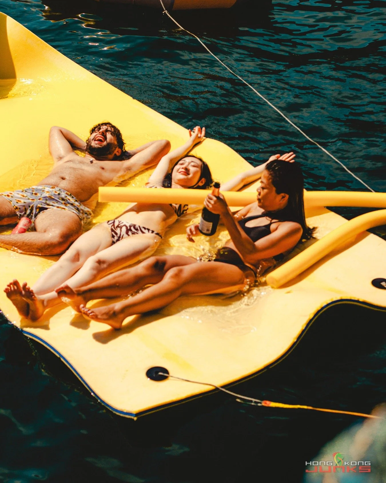 Three positions, one mission: stay horizontal until the bottle&rsquo;s empty. Welcome to the official meeting of the Yellow Mat Society. Membership perks include sunshine, side-eye banter, and a tan you didn&rsquo;t sign up for.

📸 @jcbaradas
Event: