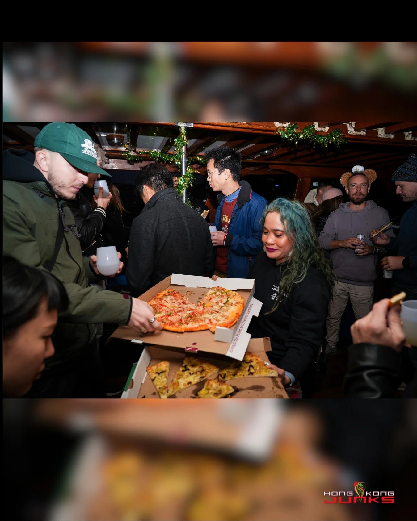 Greasy fingers, good food disappearing fast, cold drinks, and that stupidly good breeze you only get in the middle of the harbour. Everyone&rsquo;s crowding around the pizza boxes like they&rsquo;re treasure, music&rsquo;s thumping, and suddenly the 