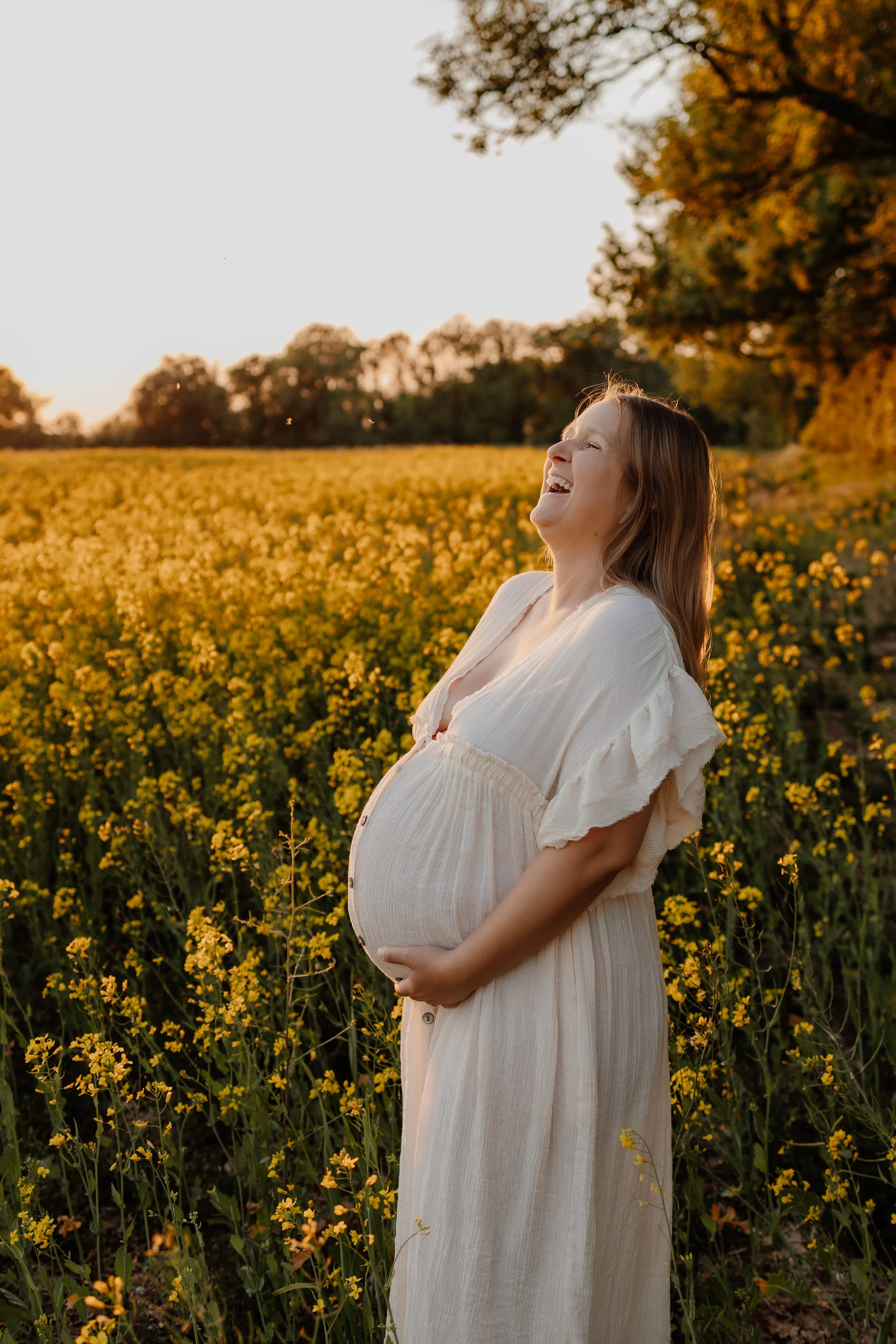 Golden hour maternity photoshoot in flower field