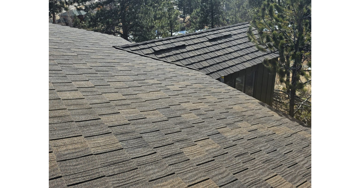 Residential roof repair project fixing damaged asphalt shingles.